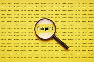 A magnifying glass over text with the words fine print enlarged | SV Partners